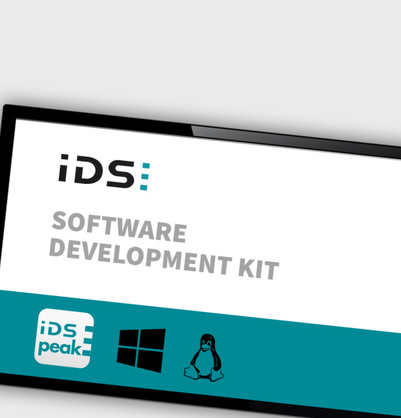 Image of a tablet with the lettering Software Development KIT and the IDS Peak logo and the Windows logo.