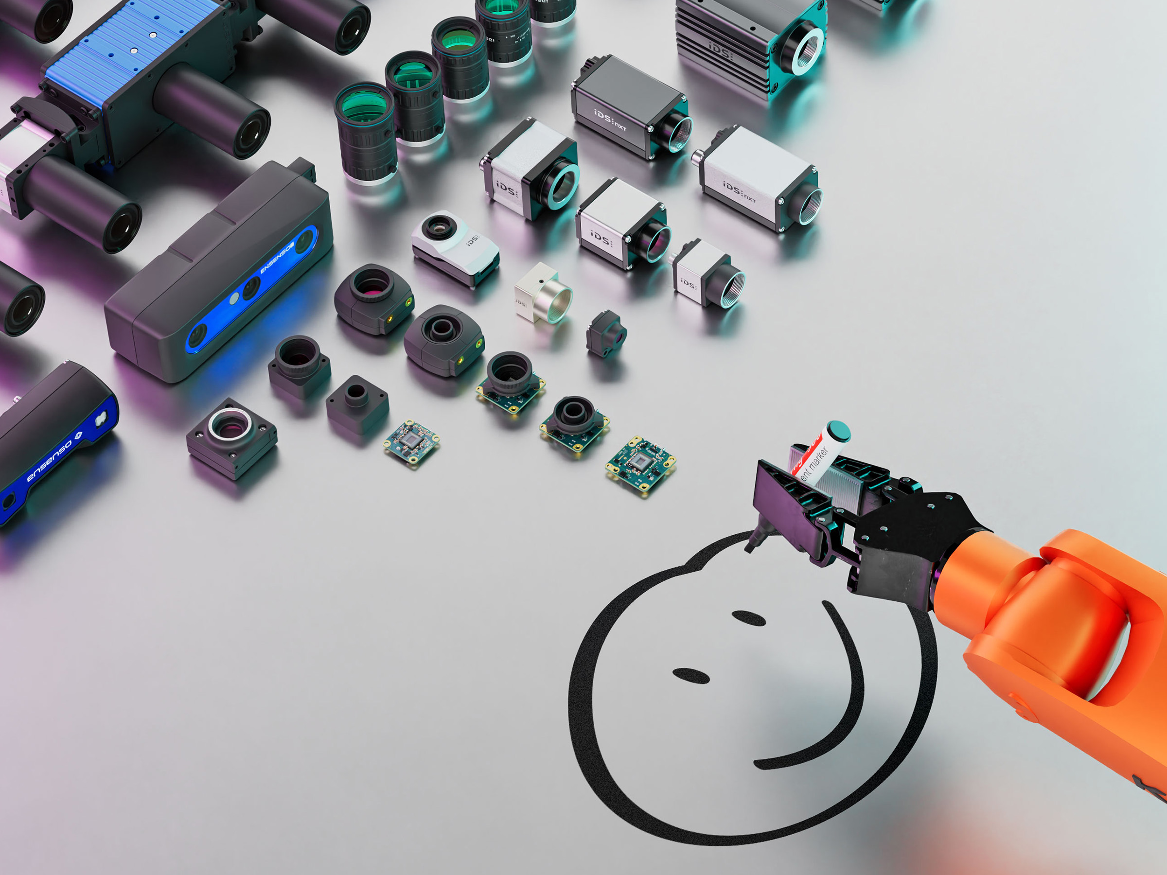 Different IDS industrial cameras lie on a surface, a gripper draws a smiley with a pen.